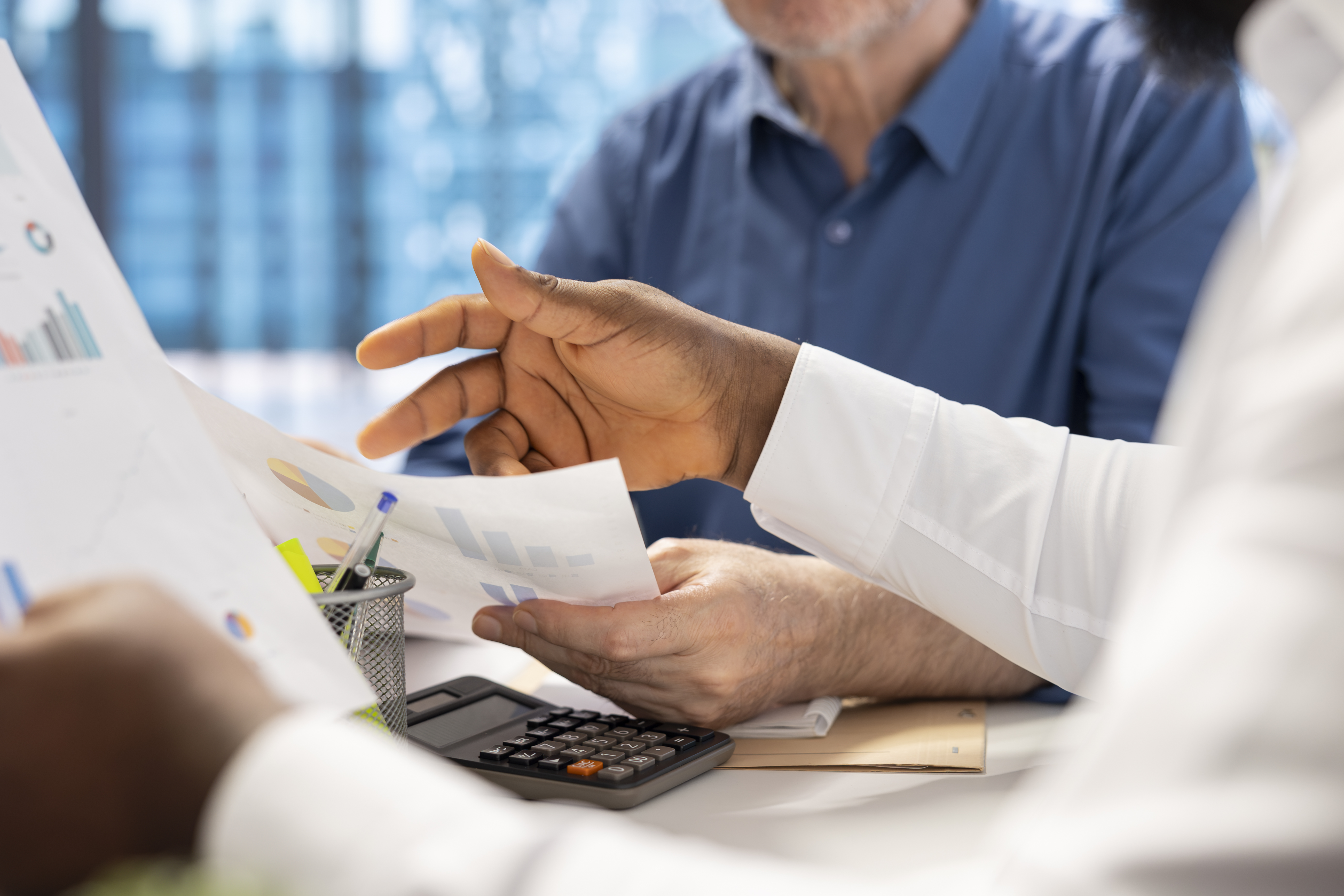senior-people-consulting-with-their-financial-banker-about-retirement-plans.jpg